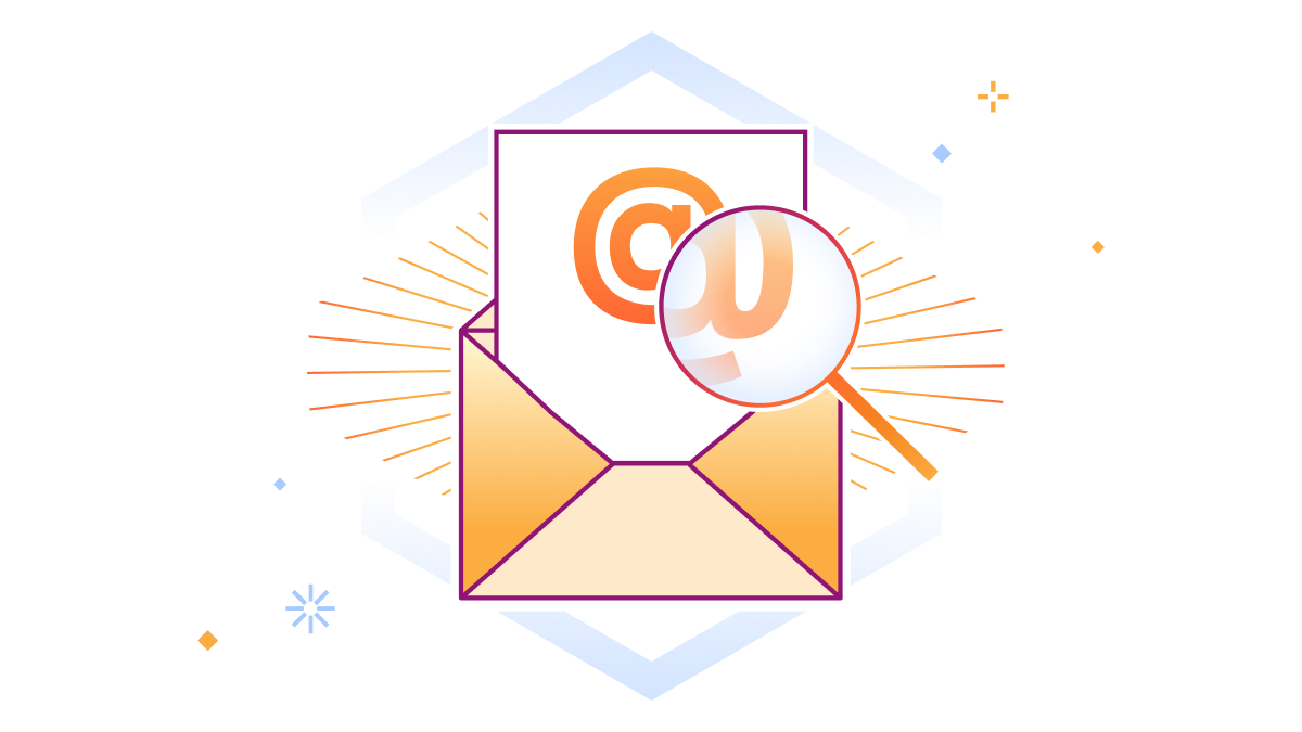 Il segno @ delle e-mail viene ingrandito da una lente d'ingrandimento